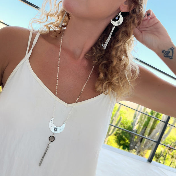 Hand-stamped moon tassel earrings with moonstone in silver