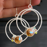 Boulder opal hoop earrings with faceted stone accents