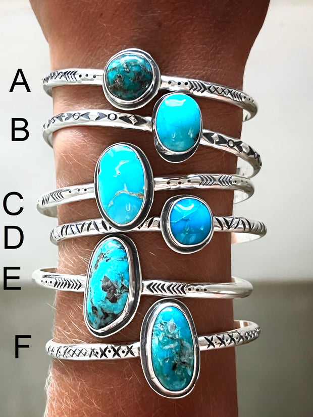 Hand-stamped turquoise cuffs in silver