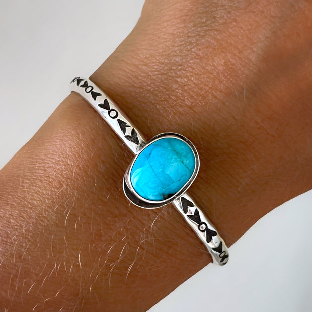 Hand-stamped turquoise cuffs in silver