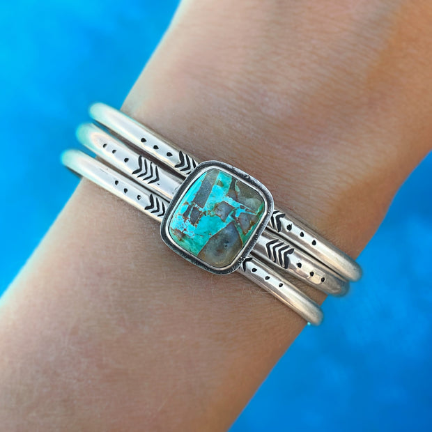 Hand-stamped turquoise cuff set in silver