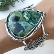 Opalized rhyolite cuff with cedar leaves and pine tree cut-out